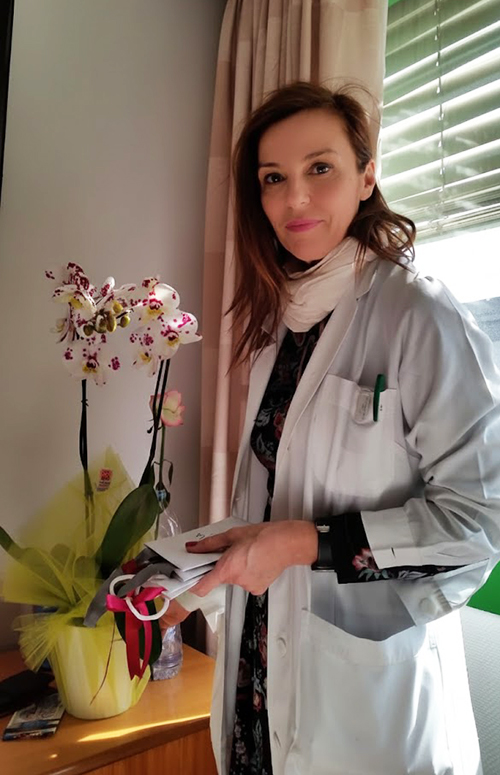 Photo of our doctor in white robe